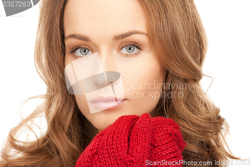 Image of beautiful woman in mittens