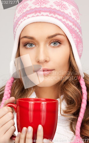 Image of woman with red mug