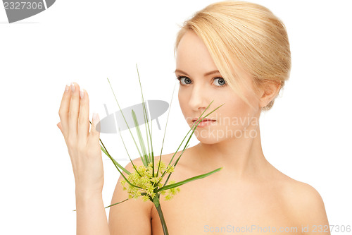 Image of woman with green sprout