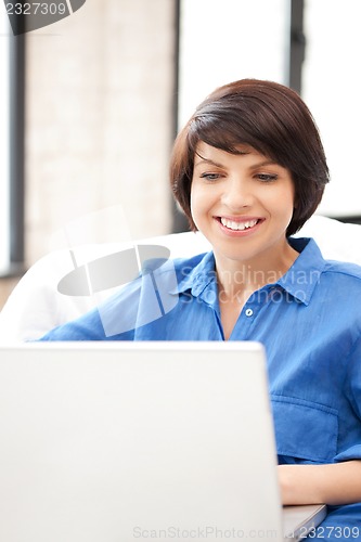 Image of happy woman with laptop computer