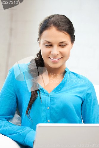 Image of happy woman with laptop computer