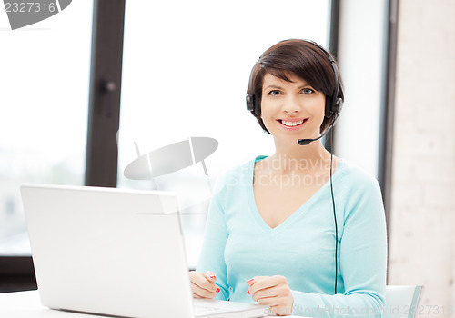 Image of helpline operator with laptop computer