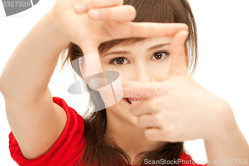 Image of teenage girl creating a frame with fingers