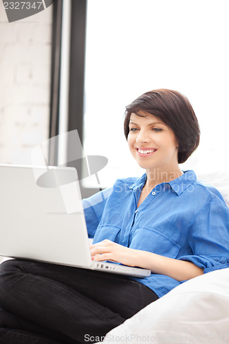 Image of happy woman with laptop computer