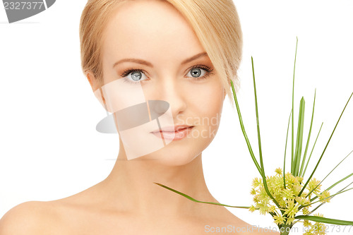 Image of woman with green sprout
