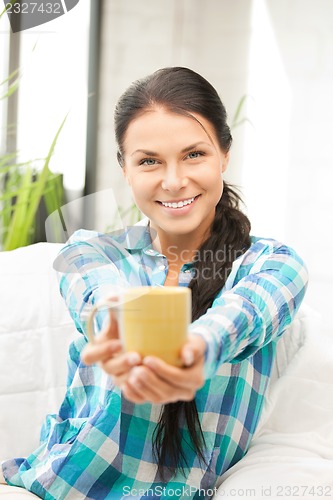 Image of lovely housewife with mug