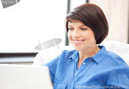 Image of happy woman with laptop computer