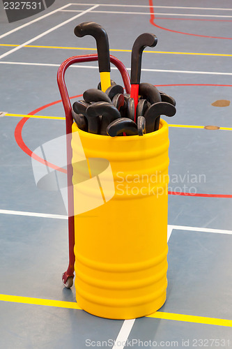 Image of Hockeysticks in an old school gym