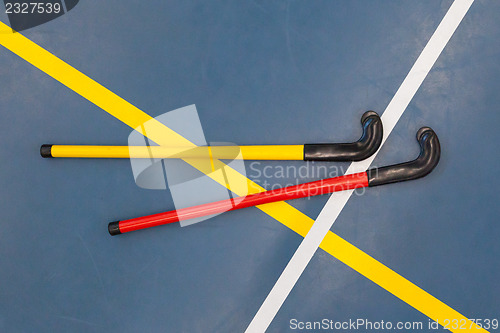 Image of Hockeysticks in an old school gym