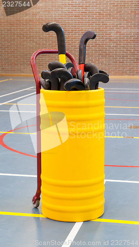 Image of Hockeysticks in an old school gym