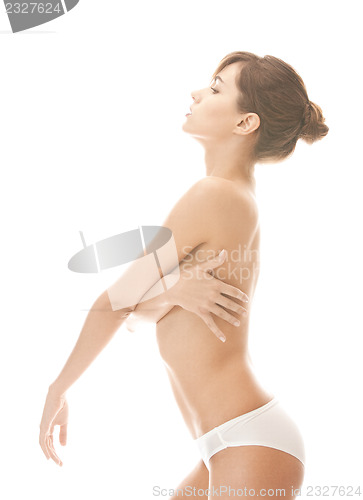 Image of beautiful topless woman in panties