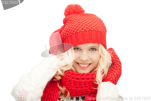 Image of beautiful woman in hat, muffler and mittens