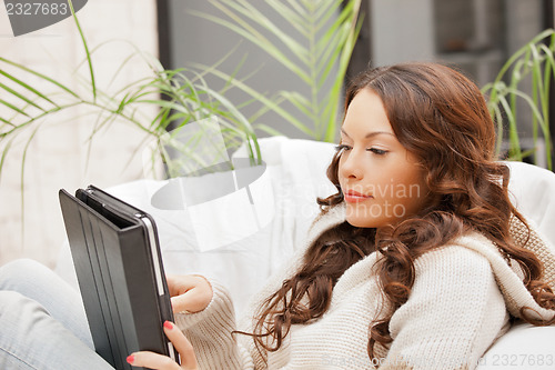 Image of calm woman with tablet pc computer