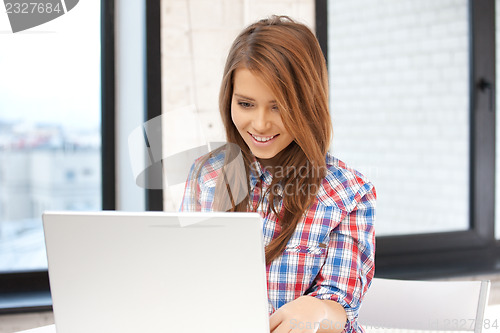 Image of happy woman with laptop computer