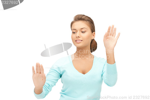 Image of businesswoman working with something imaginary