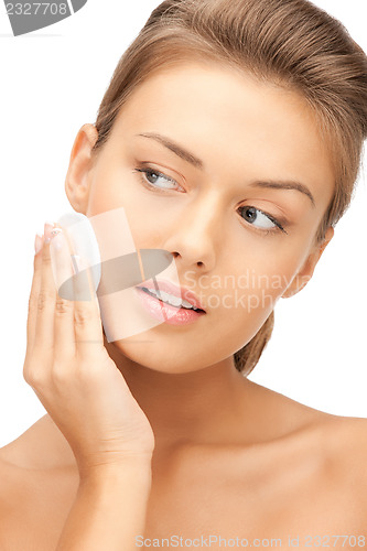 Image of beautiful woman with cotton pad