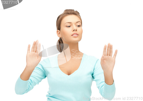 Image of businesswoman working with something imaginary