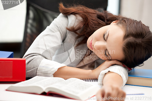 Image of sleeping woman with book