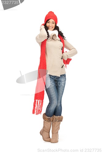 Image of beautiful woman in hat, muffler and mittens