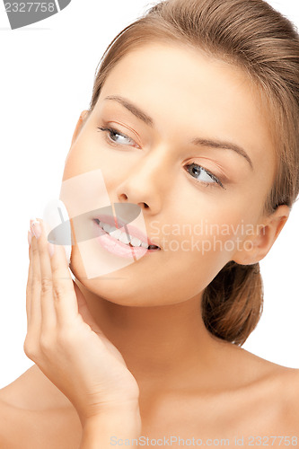 Image of beautiful woman with cotton pad