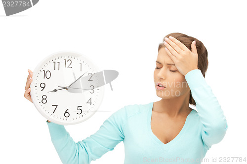 Image of woman holding big clock