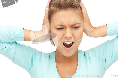 Image of woman with hands on ears