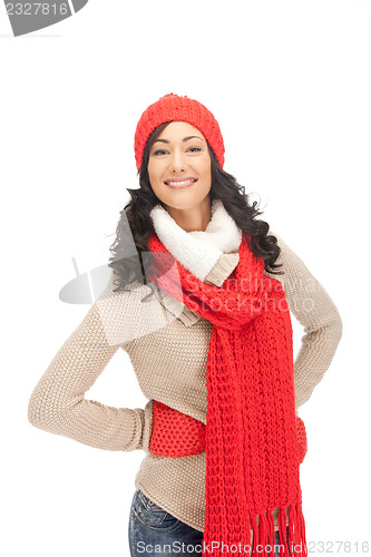 Image of beautiful woman in hat, muffler and mittens