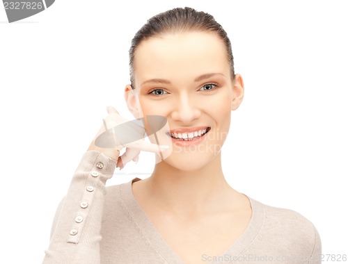 Image of woman making a call me gesture