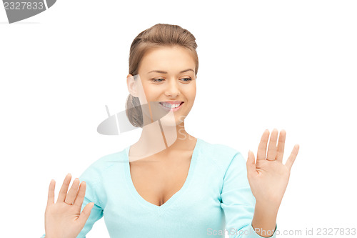 Image of businesswoman working with something imaginary