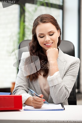 Image of happy woman with big notepad