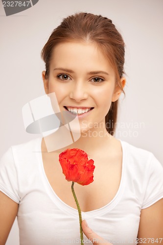 Image of beautiful woman with red flower