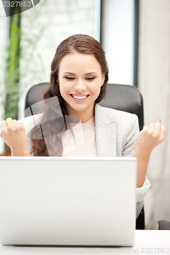 Image of happy woman with laptop computer