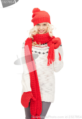 Image of beautiful woman in hat, muffler and mittens