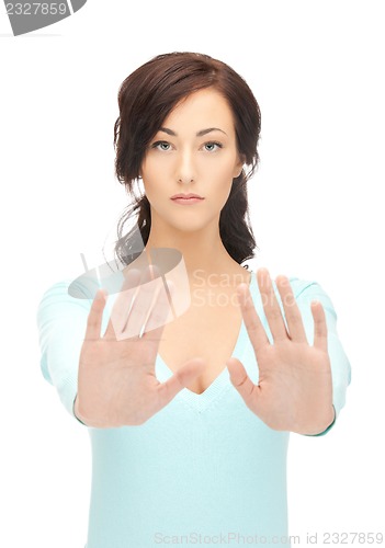 Image of woman making stop gesture