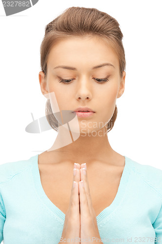 Image of praying businesswoman