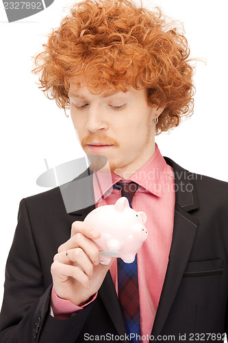 Image of man with piggy bank