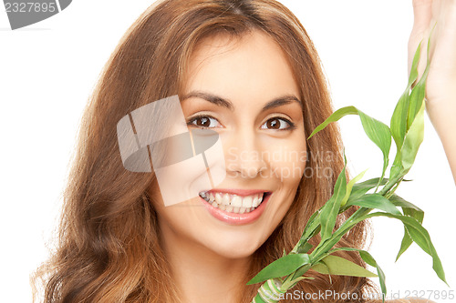 Image of woman with green sprout