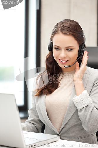 Image of helpline operator with laptop computer