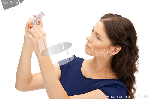 Image of lovely woman with euro cash money