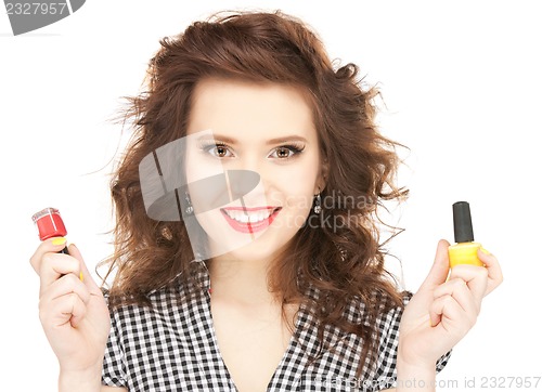 Image of beautiful woman polishing her nails