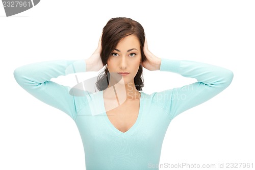 Image of woman with hands on ears