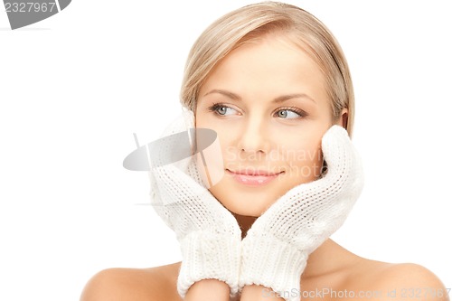 Image of beautiful woman in mittens