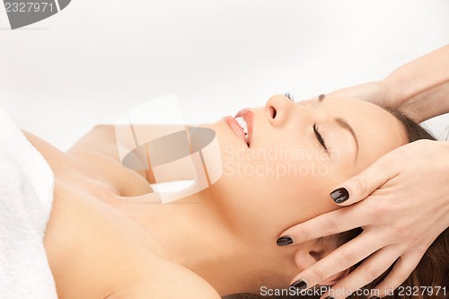 Image of beautiful woman in massage salon