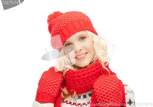 Image of beautiful woman in hat, muffler and mittens