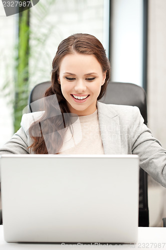 Image of happy woman with laptop computer