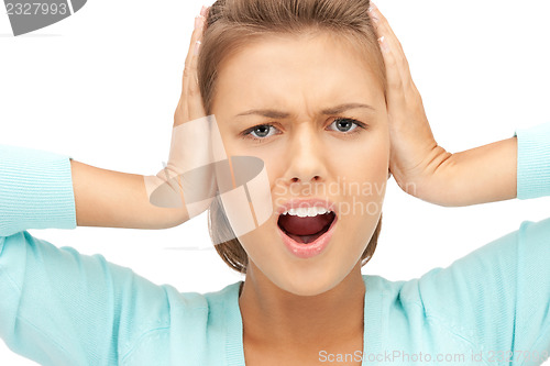 Image of woman with hands on ears