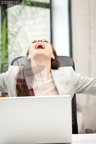 Image of happy woman with laptop computer