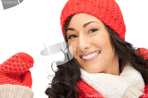 Image of beautiful woman in hat, muffler and mittens