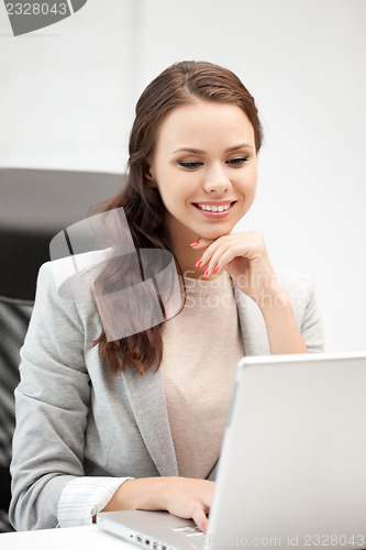 Image of happy woman with laptop computer
