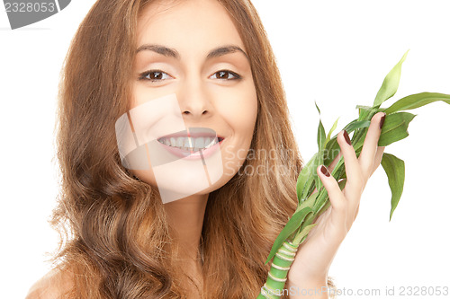 Image of woman with green sprout